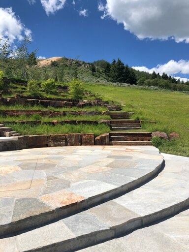 Outdoor hardscape design showing an ampitheater type installation.